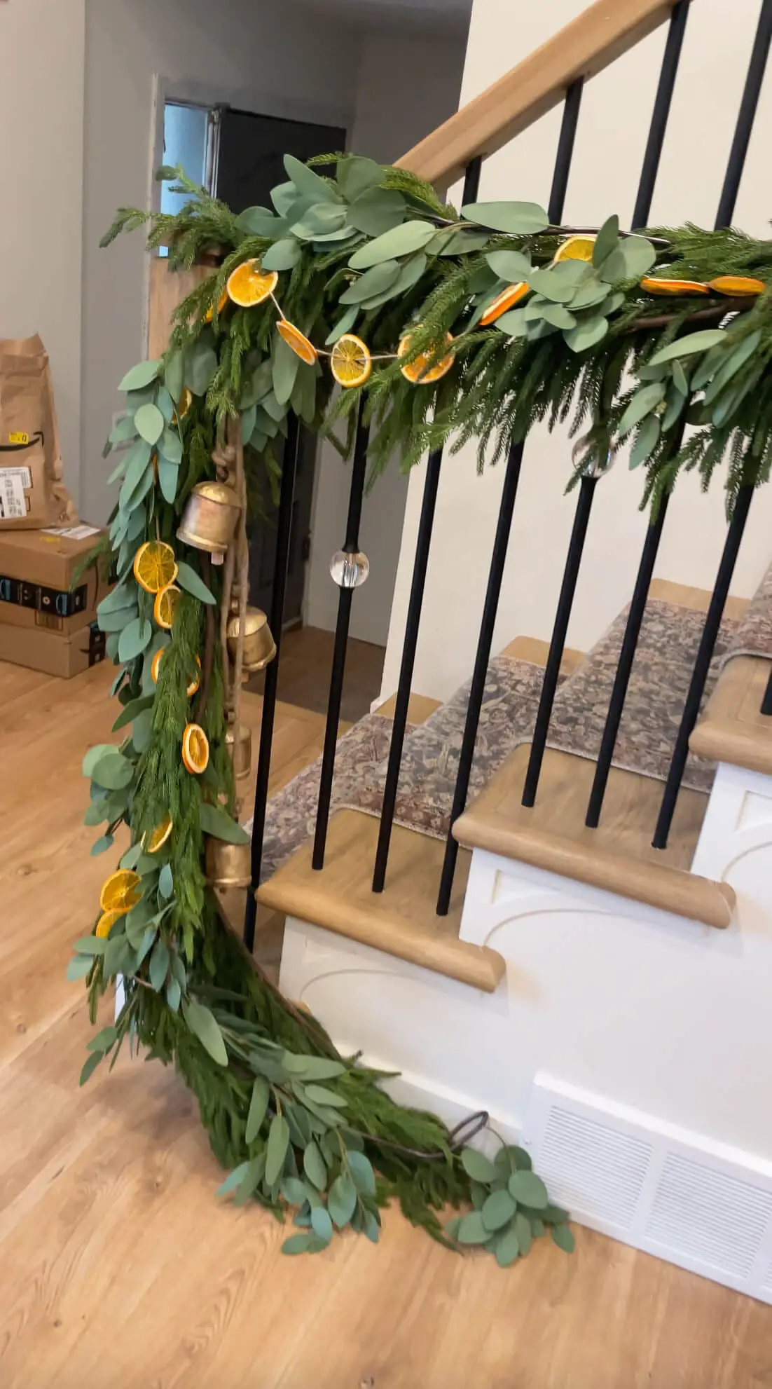 Three types of Christmas garland on a staircase.